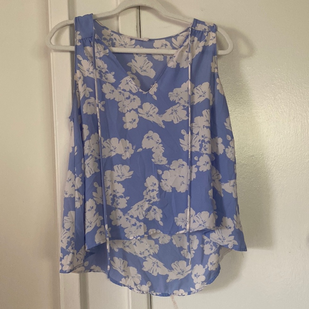 Blue and white floral tank top with ties from Lush. Size M